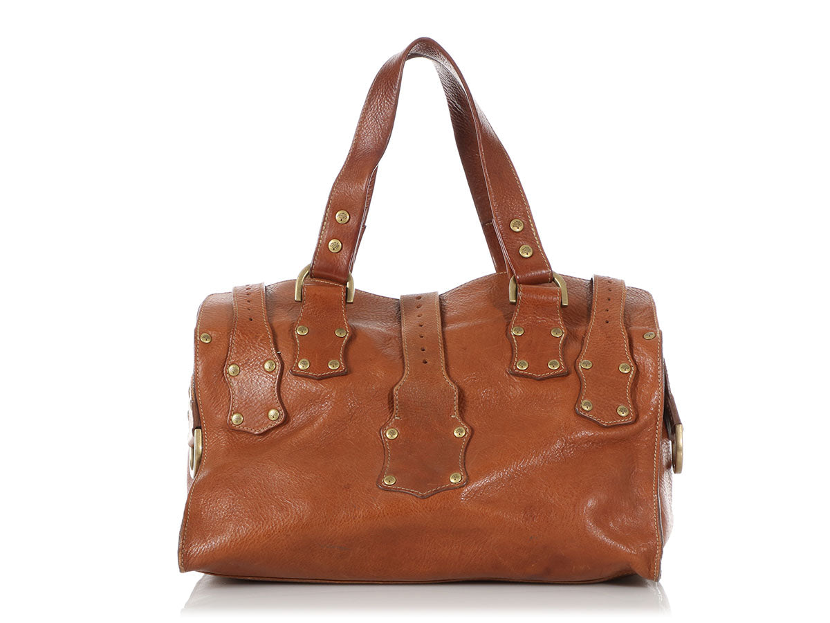Premium Photo | A woman's bag on a window seat women's leather bag brand bag